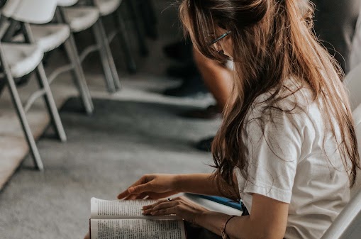 Course Outline a girl reading a book